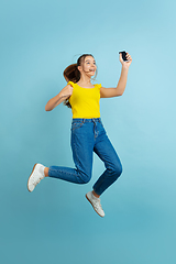 Image showing Caucasian teen girl portrait isolated on blue studio background