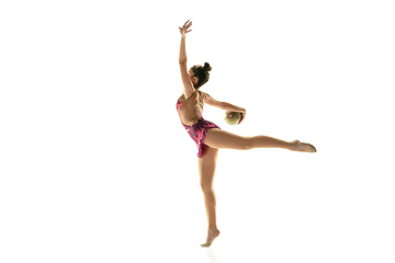Image showing Young flexible female gymnast isolated on white studio background