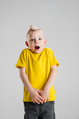 Image showing Happy boy isolated on white studio background. Looks happy, cheerful, sincere. Copyspace. Childhood, education, emotions concept