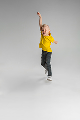 Image showing Happy boy isolated on white studio background. Looks happy, cheerful, sincere. Copyspace. Childhood, education, emotions concept