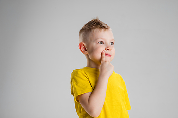 Image showing Happy boy isolated on white studio background. Looks happy, cheerful, sincere. Copyspace. Childhood, education, emotions concept