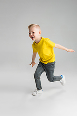 Image showing Happy boy isolated on white studio background. Looks happy, cheerful, sincere. Copyspace. Childhood, education, emotions concept