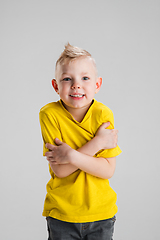 Image showing Happy boy isolated on white studio background. Looks happy, cheerful, sincere. Copyspace. Childhood, education, emotions concept