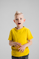 Image showing Happy boy isolated on white studio background. Looks happy, cheerful, sincere. Copyspace. Childhood, education, emotions concept