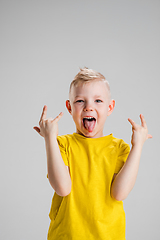 Image showing Happy boy isolated on white studio background. Looks happy, cheerful, sincere. Copyspace. Childhood, education, emotions concept