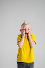 Image showing Happy boy isolated on white studio background. Looks happy, cheerful, sincere. Copyspace. Childhood, education, emotions concept