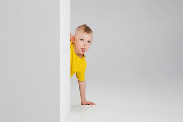 Image showing Happy boy isolated on white studio background. Looks happy, cheerful, sincere. Copyspace. Childhood, education, emotions concept