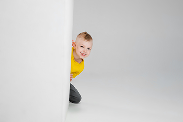 Image showing Happy boy isolated on white studio background. Looks happy, cheerful, sincere. Copyspace. Childhood, education, emotions concept