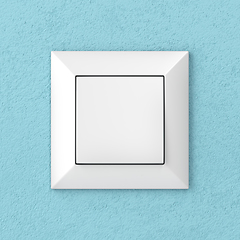 Image showing Light switch on blue wall