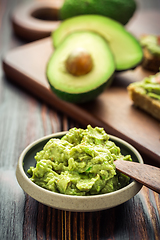 Image showing Guacamole dip or spread on wooden kitchen table