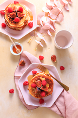 Image showing Sweet curd cheese pancakes with fresh raspberry, figs and maple sirup