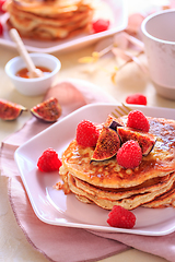 Image showing Sweet curd cheese pancakes with fresh raspberry, figs and maple 