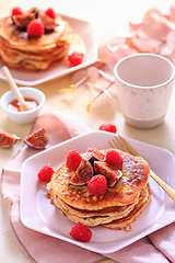 Image showing Sweet curd cheese pancakes with fresh raspberry, figs and maple sirup