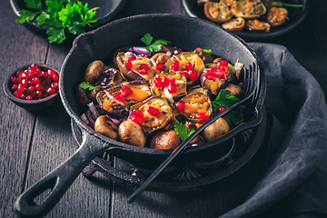 Image showing Baked small eggplants, stuffed with mushrooms and pomegranate