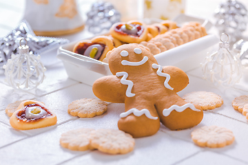 Image showing Homemade Christmas cookies and gingerbread with ornaments in white