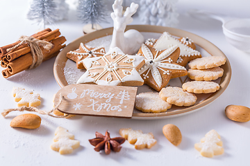 Image showing Homemade Christmas cookies with ornaments in white