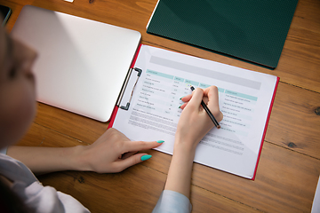 Image showing Close up manager working in modern office using devices and gadgets during creative meeting