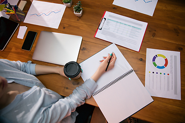 Image showing Close up manager working in modern office using devices and gadgets during creative meeting