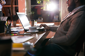 Image showing Close up manager working in modern office using devices and gadgets during creative meeting