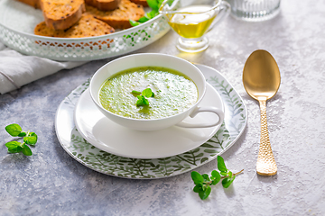 Image showing Homemade zucchini soup with tomato ciabatta bread and herbs