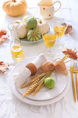 Image showing Place settings for Thanksgiving with pumpkins and apple wine