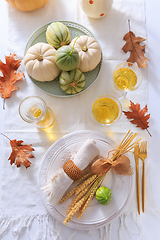 Image showing Place settings for Thanksgiving with pumpkins and apple wine