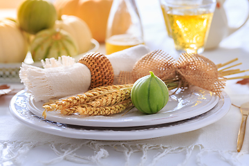 Image showing Place settings for Thanksgiving with pumpkins and apple wine