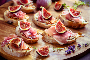 Image showing Small open sandwiches with ciabatta, proscuitto and fresh figs