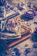 Image showing Memories - old family photo album with necklace, old books and d