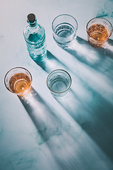 Image showing Water in vintage glasses and bottle 