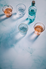 Image showing Water in vintage glasses and bottle 