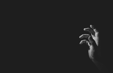 Image showing Hand with light and shadow, black an white, isolated on black