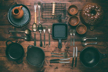 Image showing Assortment of vintage kitchen utensils on wooden table