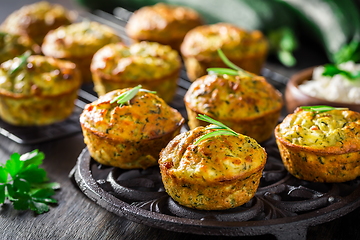 Image showing Homemade zucchini muffins with feta cheese and herbs