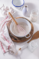 Image showing Flour and egg with baking ingredients and kitchen utensils