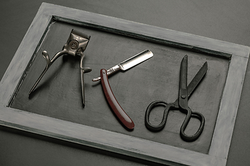 Image showing Vintage steel scissors on wooden table background