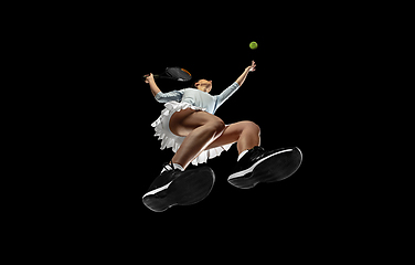 Image showing Female professional tennis player in action, motion isolated on black background, look from the bottom. Concept of sport, movement, energy and dynamic.