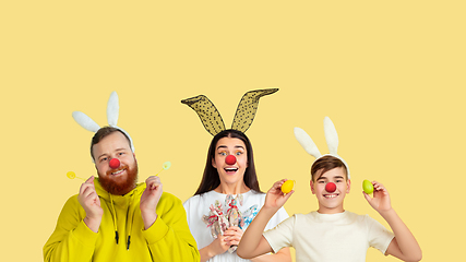 Image showing Portrait of young people celebrating red nose day on yellow background