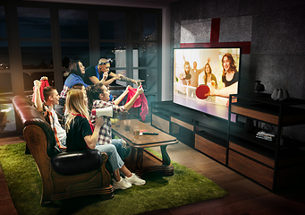 Image showing Group of friends watching TV, table tennis match in England, sport games