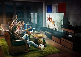 Image showing Group of friends watching TV, football match in France, sport games