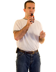 Image showing Man Smelling Cough Medicine
