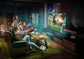 Image showing Group of friends watching TV, football match in France, sport games