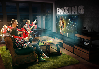 Image showing Group of friends watching TV, boxing match, sport games