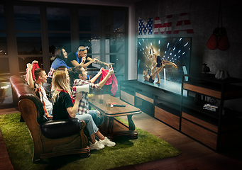 Image showing Group of friends watching TV, MMA fight in USA, sport games