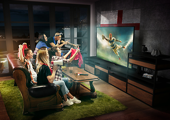 Image showing Group of friends watching TV, rugby match, sport games with England flag