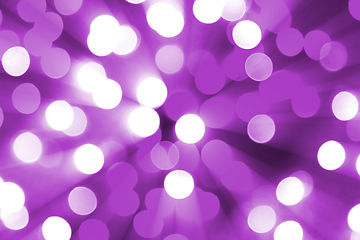 Image showing Bright blurred lights and beams holiday lilac background