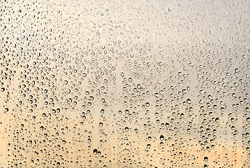 Image showing Natural water drops on glass