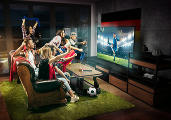 Image showing Group of friends watching TV, kids football match in Germany, sport games