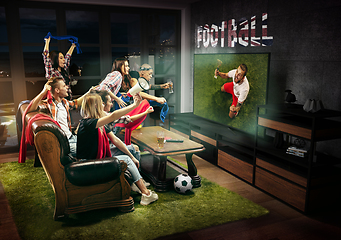 Image showing Group of friends watching TV, football match in Great Britain, sport games