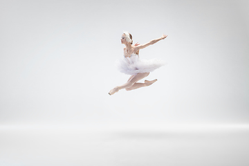 Image showing Young graceful ballerina on white studio background